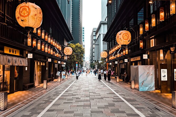 Flavours of Tokyo: A Journey Through Time - Small Group Food Tour - Walking toward Tokyo Station: International Forum, Kitte, and commuter snacks