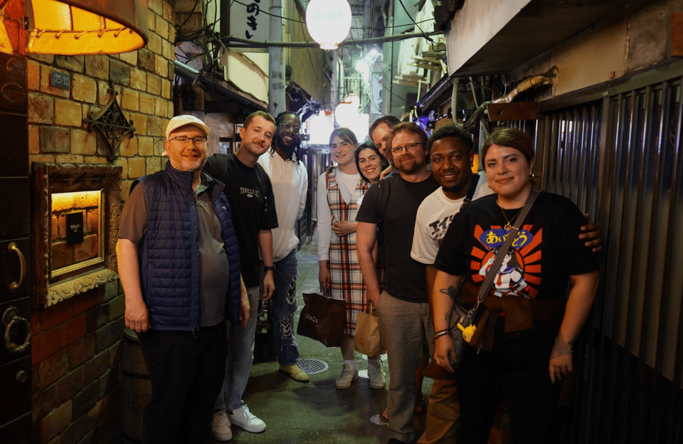 Shibuya: Local Bar & Izakaya Crawl - Finding the Group: Mizuho Bank Meeting Point and First Minutes