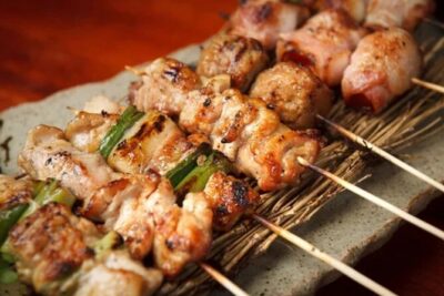 Tokyo: Shinjuku Food Tour (15 Dishes and 4 Eateries) - Meeting point near Shinjuku Station: α 107 Building and the AOKI sign