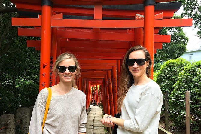 Yanaka Walking Tour: Historic and Traditional District of Tokyo - Tennoji Temple: old wooden gate, garden calm, and a bronze statue